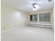 Bedroom with built-in shelving and carpet flooring at 18120 Wayne Rd, Odessa, FL 33556