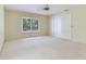 Bedroom with carpet, ceiling fan, and large closet at 18120 Wayne Rd, Odessa, FL 33556