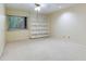 Spacious bedroom with built-in shelving and carpet at 18120 Wayne Rd, Odessa, FL 33556