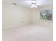 Spacious bedroom featuring carpet flooring and a large window at 18120 Wayne Rd, Odessa, FL 33556