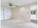 Bedroom with carpet flooring, ceiling fan, and built-in shelves at 18120 Wayne Rd, Odessa, FL 33556
