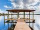 Lakefront property with a covered boat dock and spacious deck at 18120 Wayne Rd, Odessa, FL 33556