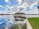 Private boat dock with gazebo on calm lake water at 18120 Wayne Rd, Odessa, FL 33556