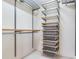Walk-in closet featuring custom shelving and storage solutions at 18120 Wayne Rd, Odessa, FL 33556