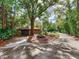 Home featuring a long driveway and a well-manicured front yard at 18120 Wayne Rd, Odessa, FL 33556