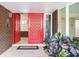 Red front door and welcoming entryway at 18120 Wayne Rd, Odessa, FL 33556