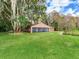 Lakefront home with a spacious screened porch at 18120 Wayne Rd, Odessa, FL 33556