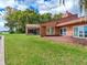 Side view of the house, highlighting the screened porch at 18120 Wayne Rd, Odessa, FL 33556