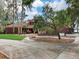 Brick house front with circular driveway at 18120 Wayne Rd, Odessa, FL 33556