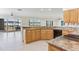Kitchen with granite countertops, wood cabinets, and a view of the water at 18120 Wayne Rd, Odessa, FL 33556
