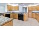 Kitchen with granite countertops and light wood cabinets at 18120 Wayne Rd, Odessa, FL 33556