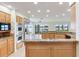 Spacious kitchen with stainless steel appliances, lake views and granite countertops at 18120 Wayne Rd, Odessa, FL 33556