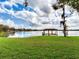 Scenic lakefront property featuring a private dock and gazebo at 18120 Wayne Rd, Odessa, FL 33556