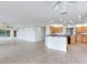 Open living area with a view to the kitchen and access to the yard at 18120 Wayne Rd, Odessa, FL 33556