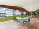 Spacious screened porch with lake view and patio furniture at 18120 Wayne Rd, Odessa, FL 33556