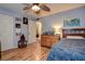 Cozy bedroom with wood flooring, ceiling fan, and closet, offers a comfortable retreat at 2993 W Vina Del Mar Blvd, St Pete Beach, FL 33706