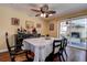 Dining area featuring elegant furniture, unique decor, and sliding door access to a patio at 2993 W Vina Del Mar Blvd, St Pete Beach, FL 33706