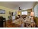 Comfortable living room features hardwood floors, ceiling fan and plenty of light at 2993 W Vina Del Mar Blvd, St Pete Beach, FL 33706