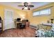 Bright office space featuring wood flooring, a desk, chair, and ample natural light at 2993 W Vina Del Mar Blvd, St Pete Beach, FL 33706