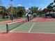 Outdoor pickleball courts with well-maintained nets and colorful playing surface on a sunny day at 2993 W Vina Del Mar Blvd, St Pete Beach, FL 33706