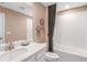 Guest bathroom with a white vanity, tiled shower/tub combo, and neutral decor at 3218 Moonlit Lily Pl, Brandon, FL 33511