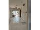 Kitchen undergoing renovation featuring light colored tiling and a sliding glass door to the backyard at 417 Boca Ciega Point N Blvd # 417, St Petersburg, FL 33708