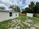 Spacious backyard with a storage shed, perfect for outdoor activities at 5038 Galaxy Dr, New Port Richey, FL 34652