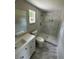 Modern bathroom with a walk-in shower, updated vanity, and contemporary fixtures at 5038 Galaxy Dr, New Port Richey, FL 34652