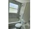 Modern bathroom featuring a bathtub, toilet, and updated fixtures at 5038 Galaxy Dr, New Port Richey, FL 34652