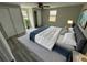 Spacious main bedroom featuring a queen bed with dual closets and a view of the backyard at 5038 Galaxy Dr, New Port Richey, FL 34652