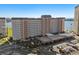 Aerial view of a residential building with covered parking and nearby water at 5130 Brittany S Dr # 505, St Petersburg, FL 33715