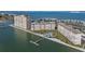 Aerial view of a waterfront condominium complex with a pool and dock at 5130 Brittany S Dr # 505, St Petersburg, FL 33715