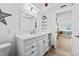 Clean and bright bathroom with white vanity and updated fixtures at 5130 Brittany S Dr # 505, St Petersburg, FL 33715