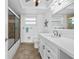 Bathroom featuring a white vanity, shower/tub combination, and tiled flooring at 5130 Brittany S Dr # 505, St Petersburg, FL 33715