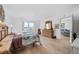 Spacious bedroom with wooden furniture and large window offering natural light at 5130 Brittany S Dr # 505, St Petersburg, FL 33715