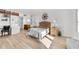 Bedroom with wood-look flooring, built-in desk and storage, and a comfortable bed at 5130 Brittany S Dr # 505, St Petersburg, FL 33715