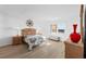 Bedroom with wooden furniture, light flooring, and a window view at 5130 Brittany S Dr # 505, St Petersburg, FL 33715