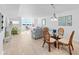 Open concept dining and living area with wicker chairs and ocean views at 5130 Brittany S Dr # 505, St Petersburg, FL 33715