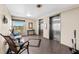 Elevator waiting area with seating, large window, and two elevators at 5130 Brittany S Dr # 505, St Petersburg, FL 33715