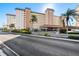 Building exterior with covered parking and tropical landscaping at 5130 Brittany S Dr # 505, St Petersburg, FL 33715