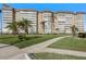 Condominium building exterior with lush landscaping and walkways at 5130 Brittany S Dr # 505, St Petersburg, FL 33715