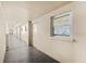 Building hallway with doors, window, and neutral decor at 5130 Brittany S Dr # 505, St Petersburg, FL 33715