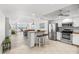 Bright kitchen with white cabinets, stainless steel appliances, and breakfast bar at 5130 Brittany S Dr # 505, St Petersburg, FL 33715