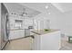 Modern white kitchen with stainless steel appliances and granite countertops at 5130 Brittany S Dr # 505, St Petersburg, FL 33715