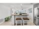 Kitchen island with seating, overlooking the dining and living areas at 5130 Brittany S Dr # 505, St Petersburg, FL 33715