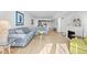 Open-concept living area with comfortable seating and view of the kitchen/dining at 5130 Brittany S Dr # 505, St Petersburg, FL 33715