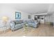 Spacious living room with plush furniture and a view towards the kitchen and dining areas at 5130 Brittany S Dr # 505, St Petersburg, FL 33715