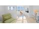 Bright living room with large windows, comfortable seating, and ocean views at 5130 Brittany S Dr # 505, St Petersburg, FL 33715