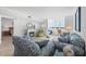Cozy living area with plush seating, fireplace, and access to the bedroom at 5130 Brittany S Dr # 505, St Petersburg, FL 33715