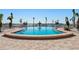 Community pool with lounge chairs and waterfront views at 5130 Brittany S Dr # 505, St Petersburg, FL 33715
